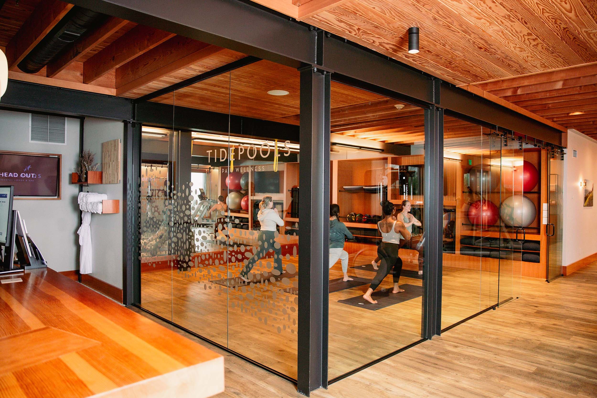The exterior of the glass walls surrounds TidePools Wellness Studio at Headlands