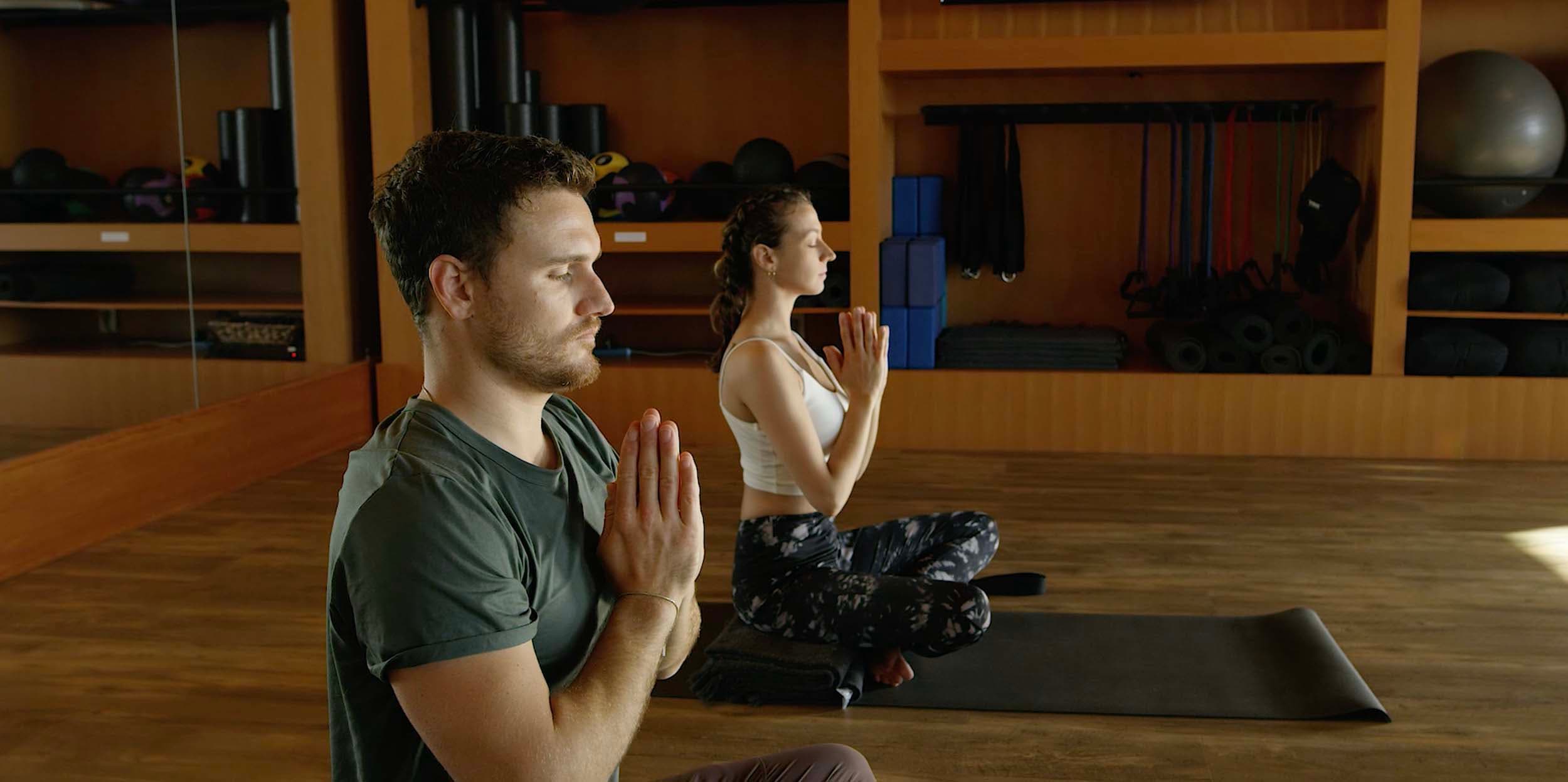 A couple doing breathwork Meditation at the wellness Studio in Headlands
