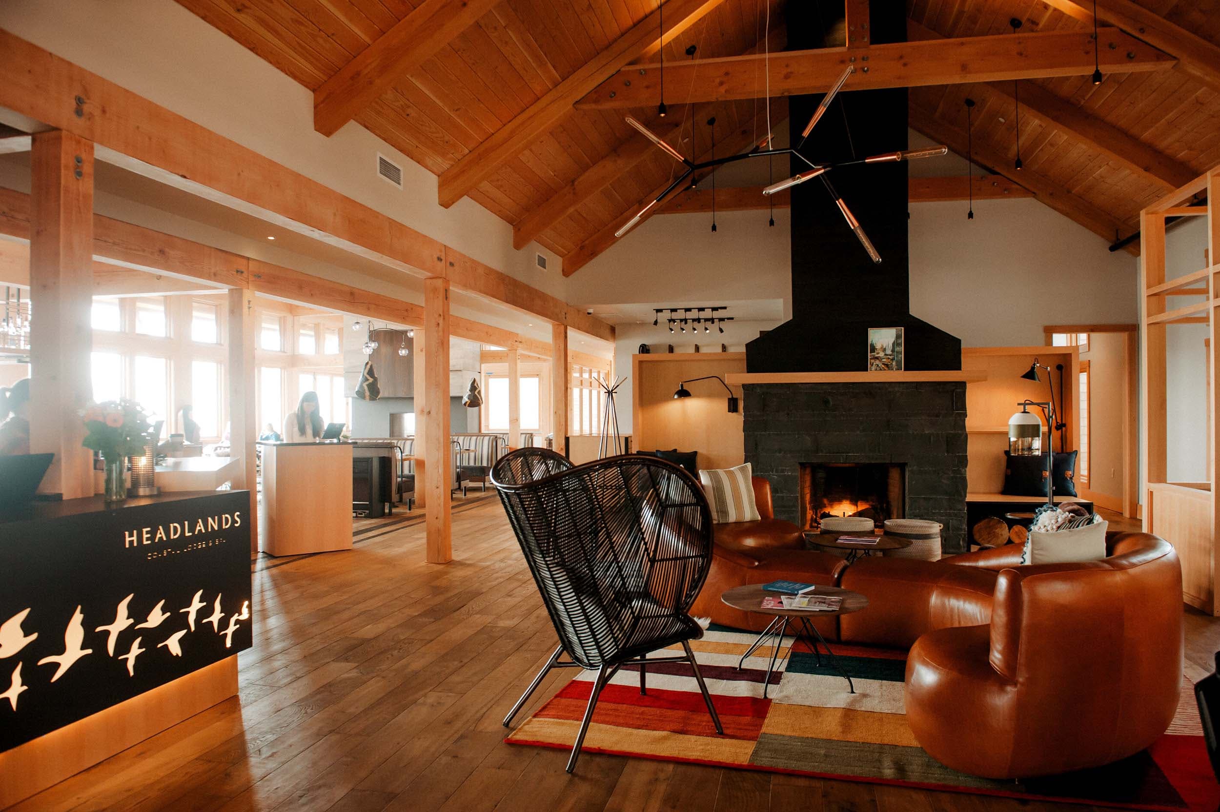 The Headlands lobby with a large fireplace and cozy lounge area