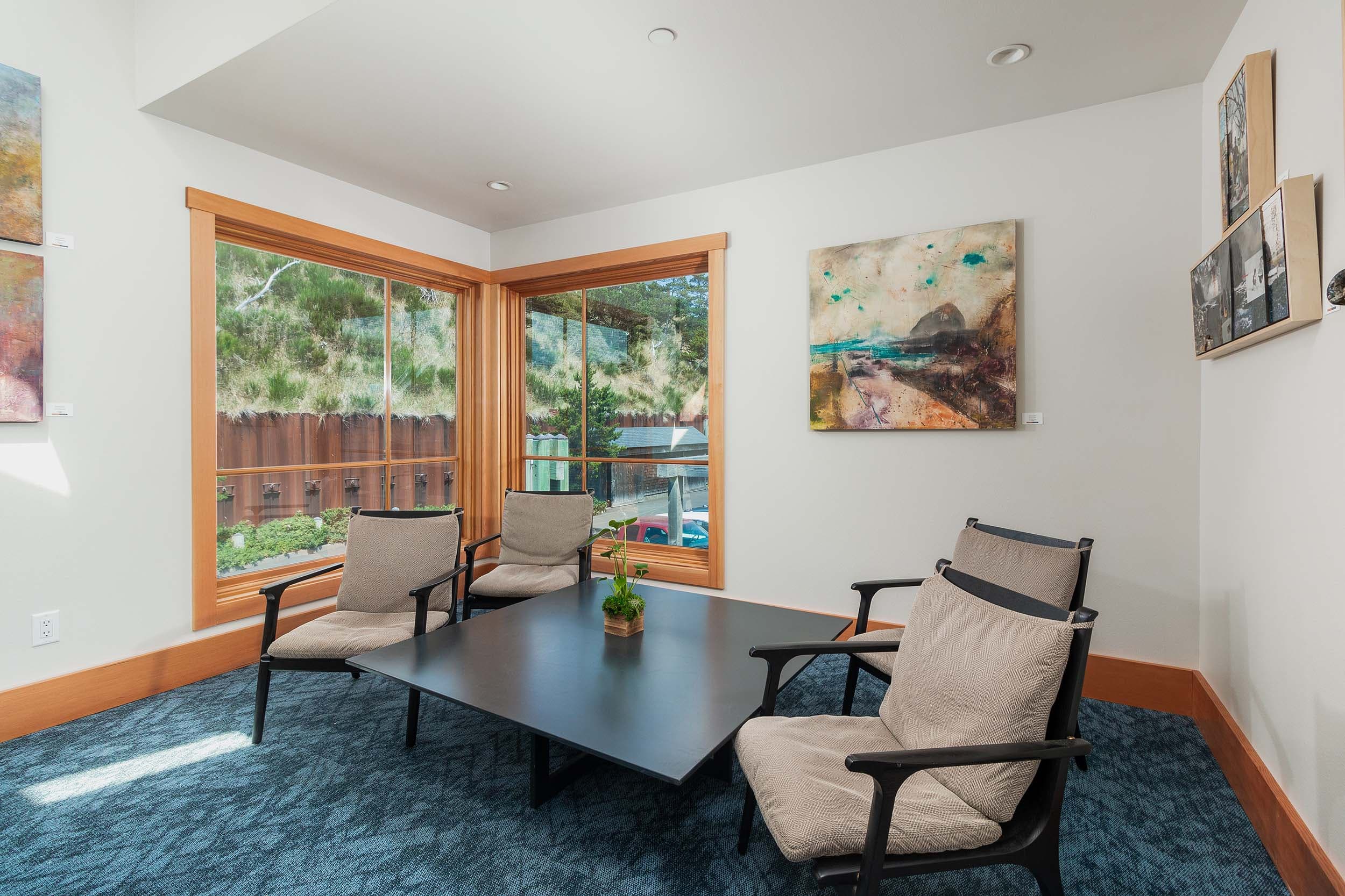 A little lounge area with a side table in the Compass Room at Headlands