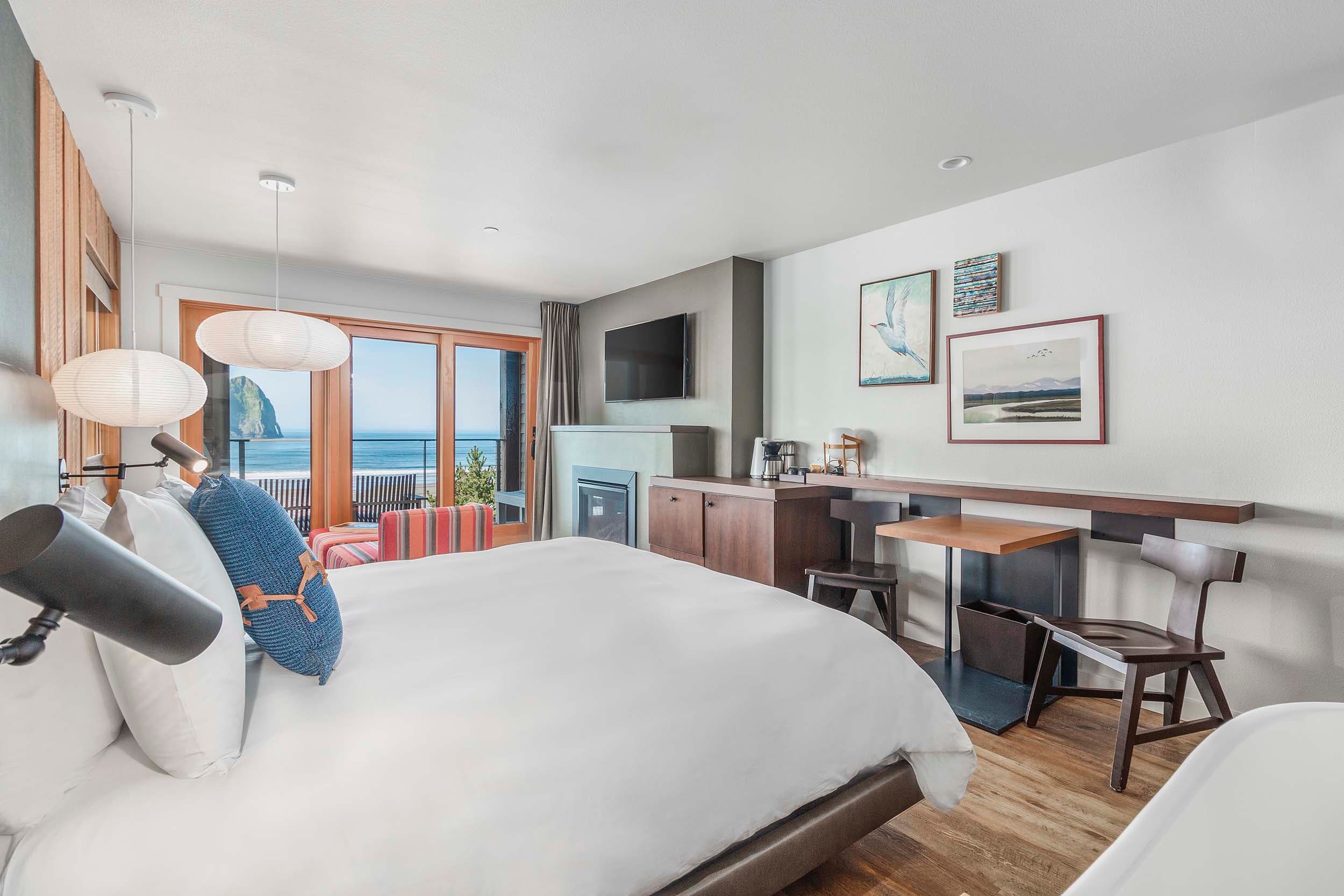 The bed, desk, and lounge area in a King Sunlight room at Headlands