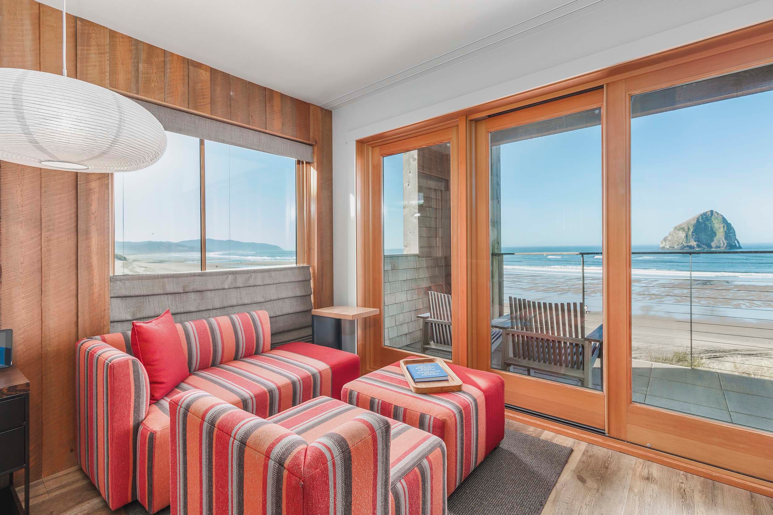 The lounge area in a King Sunlight room at Headlands with a view of Haystack rock