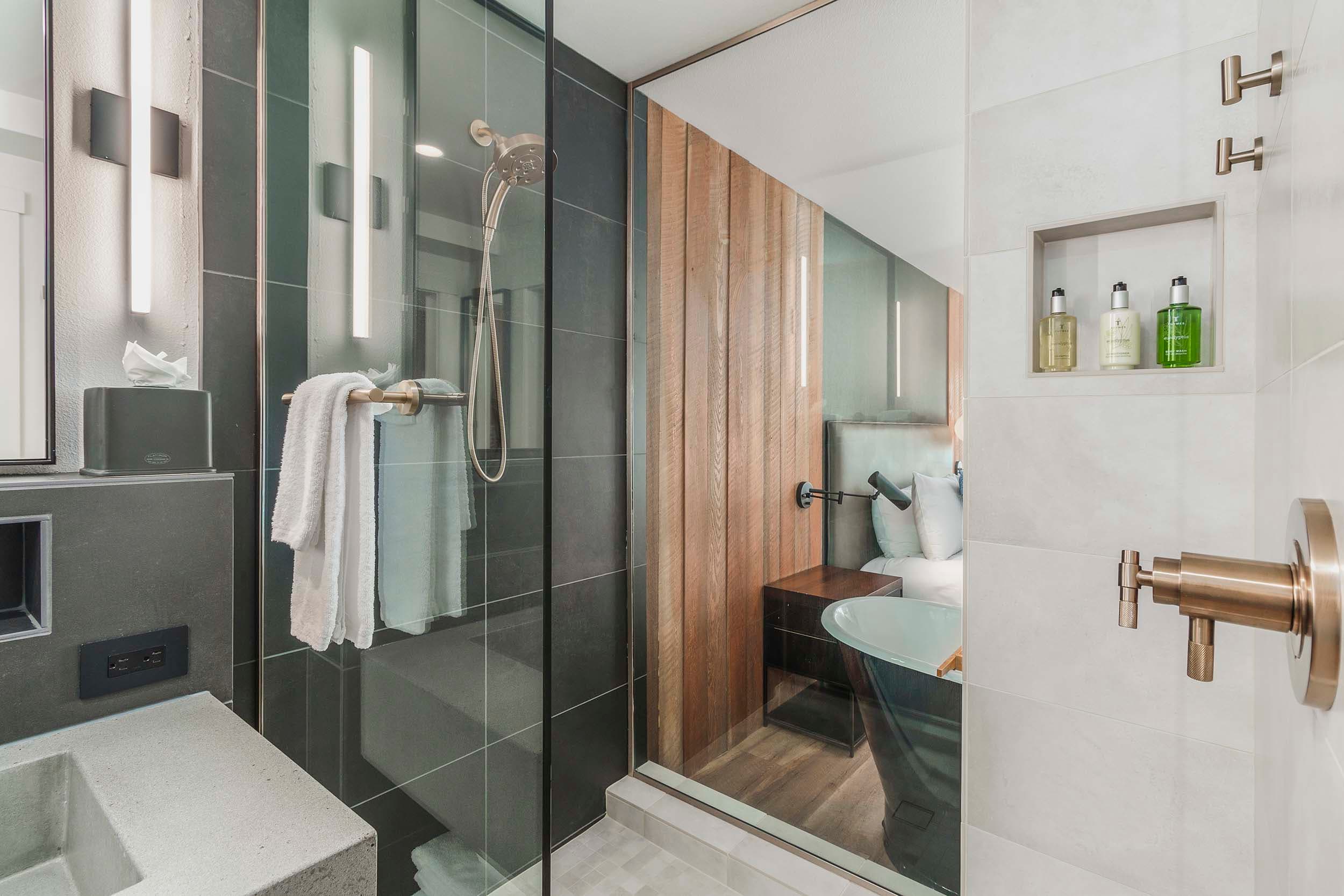 The shower and cement vanity in a King Sunlight room at Headlands