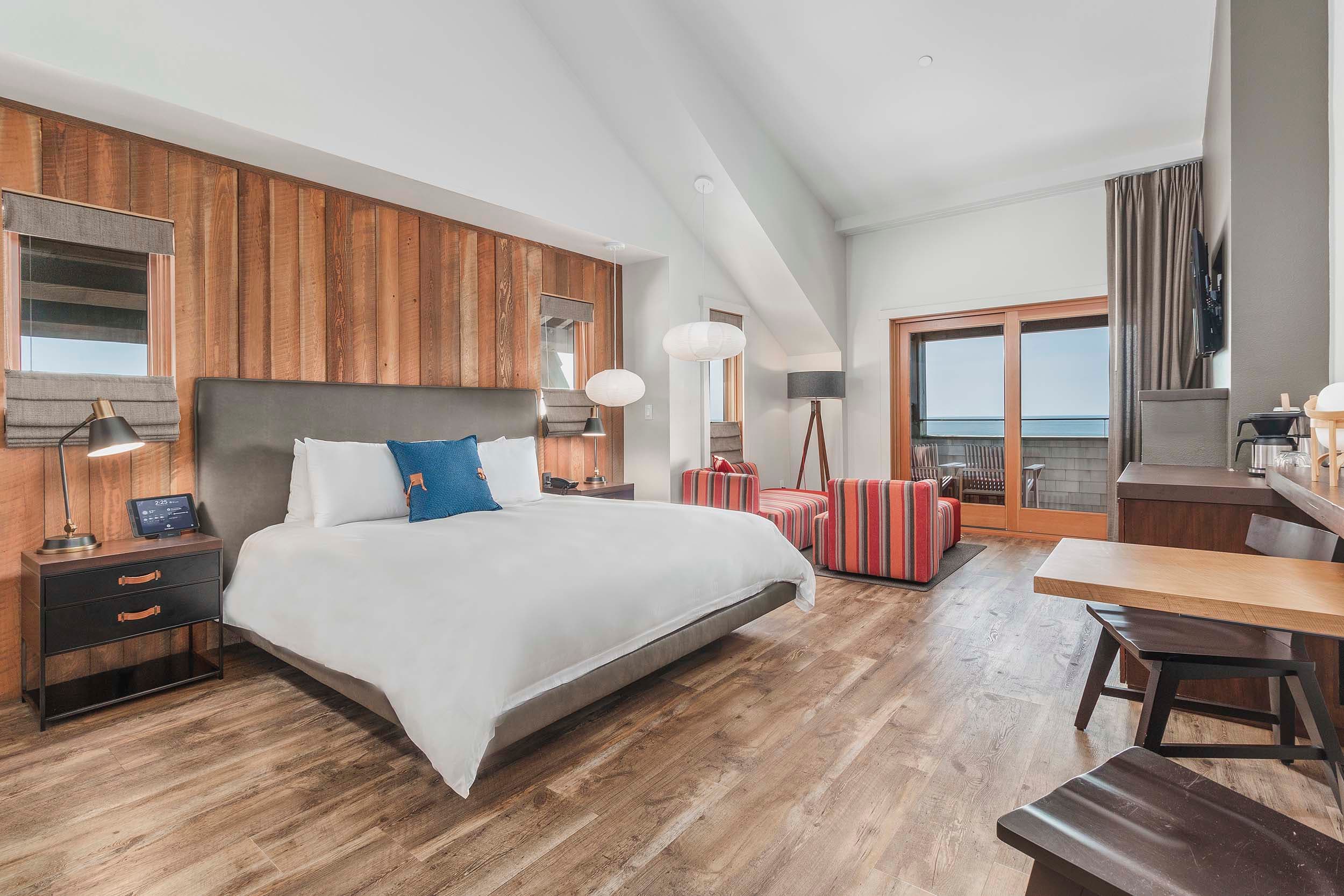 A king bed and living space in a King Sunlight Top Floor at Headlands