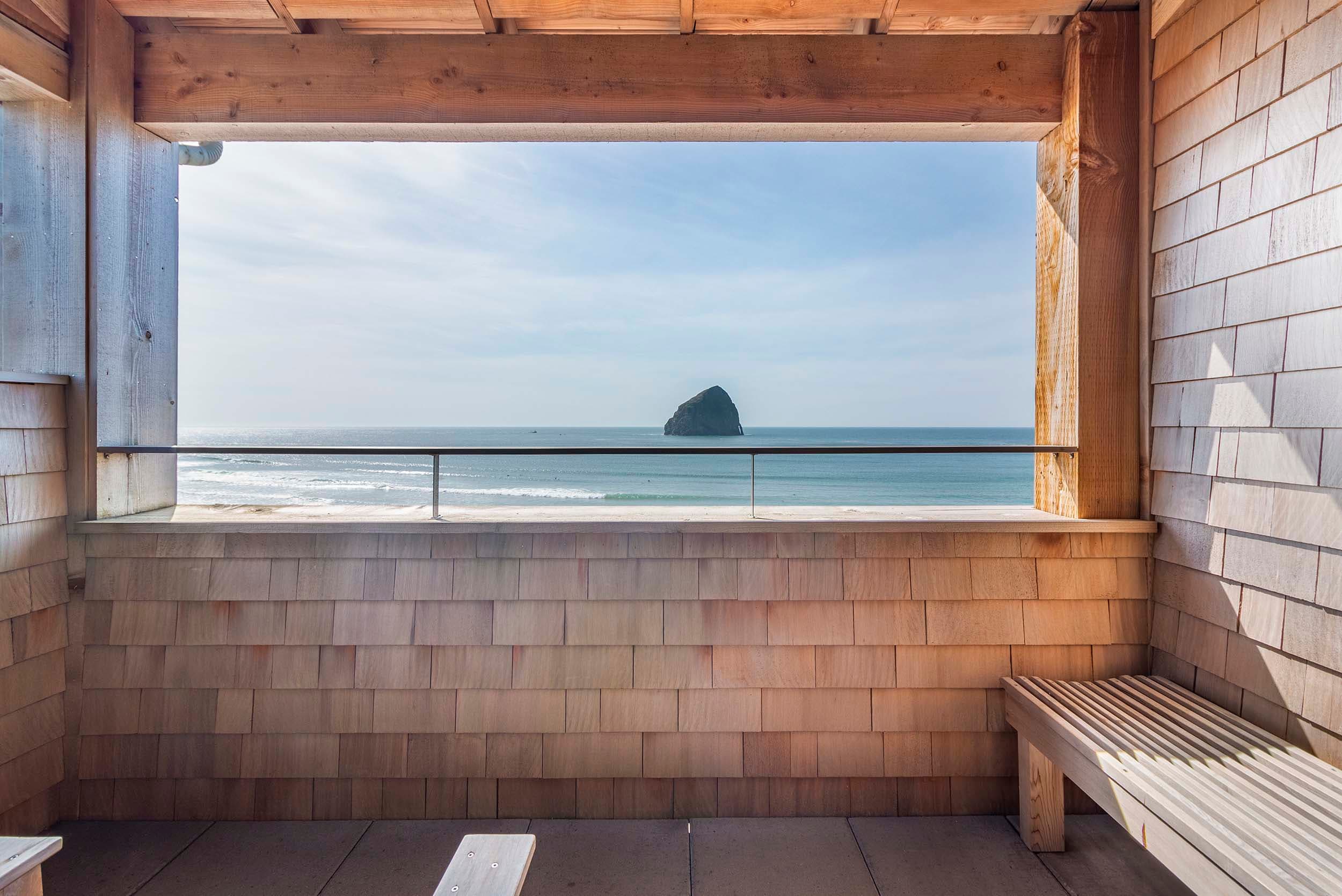 A balcony with a view of Haystack rock from a Two Queen Top Floor at Headlands