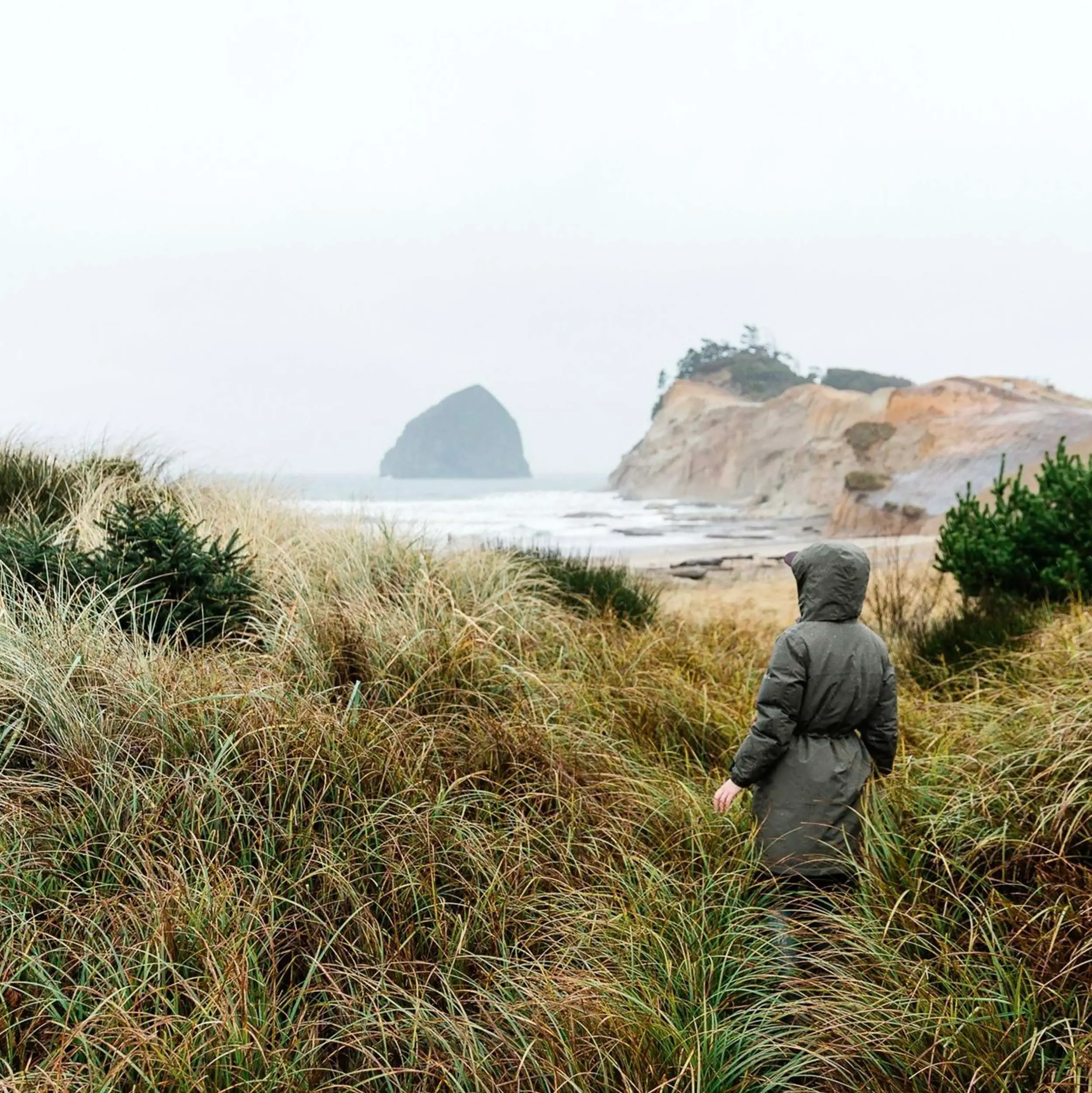 A woman walking the trails near the beach at Cape Kiwanda