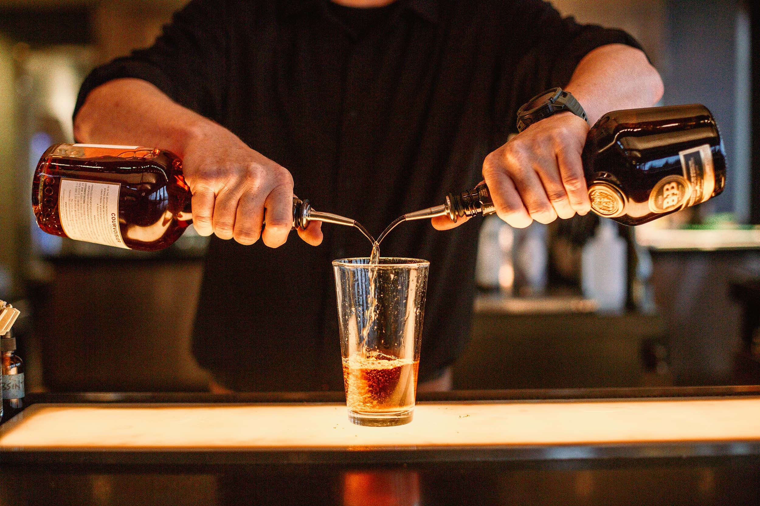 A mixologist mixing a drink
