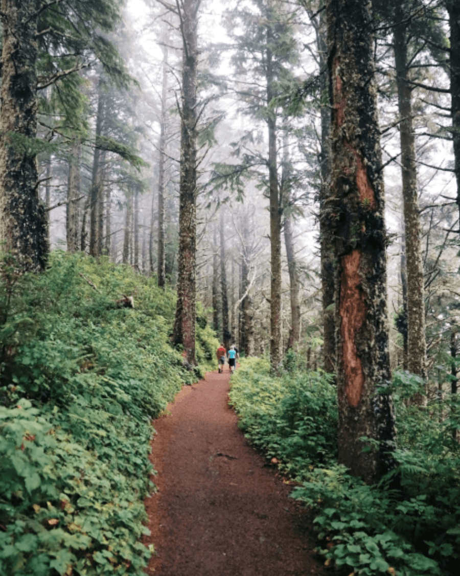 2 people walking Pacific City pathway