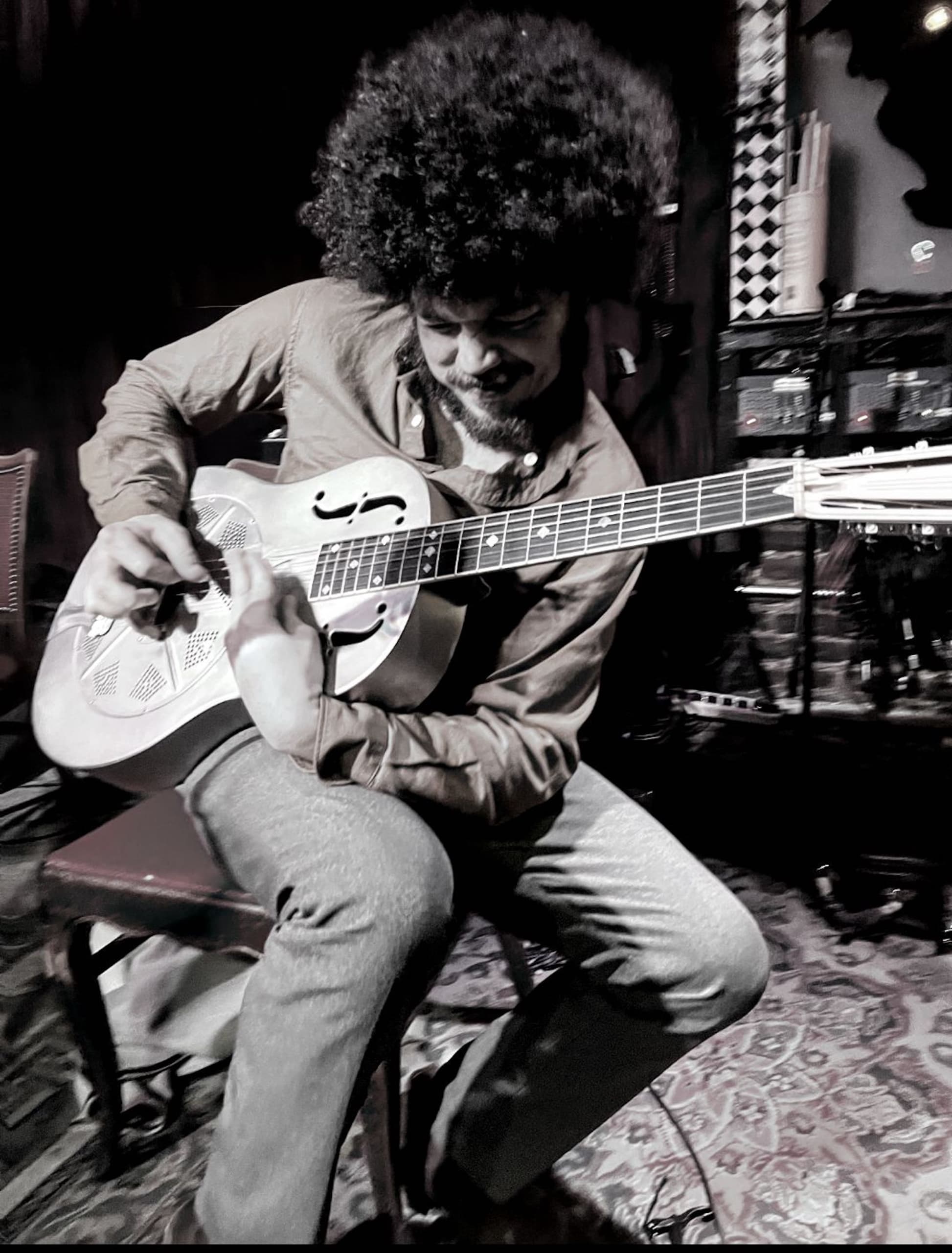 Tevis Hodge playing guitar during a live show