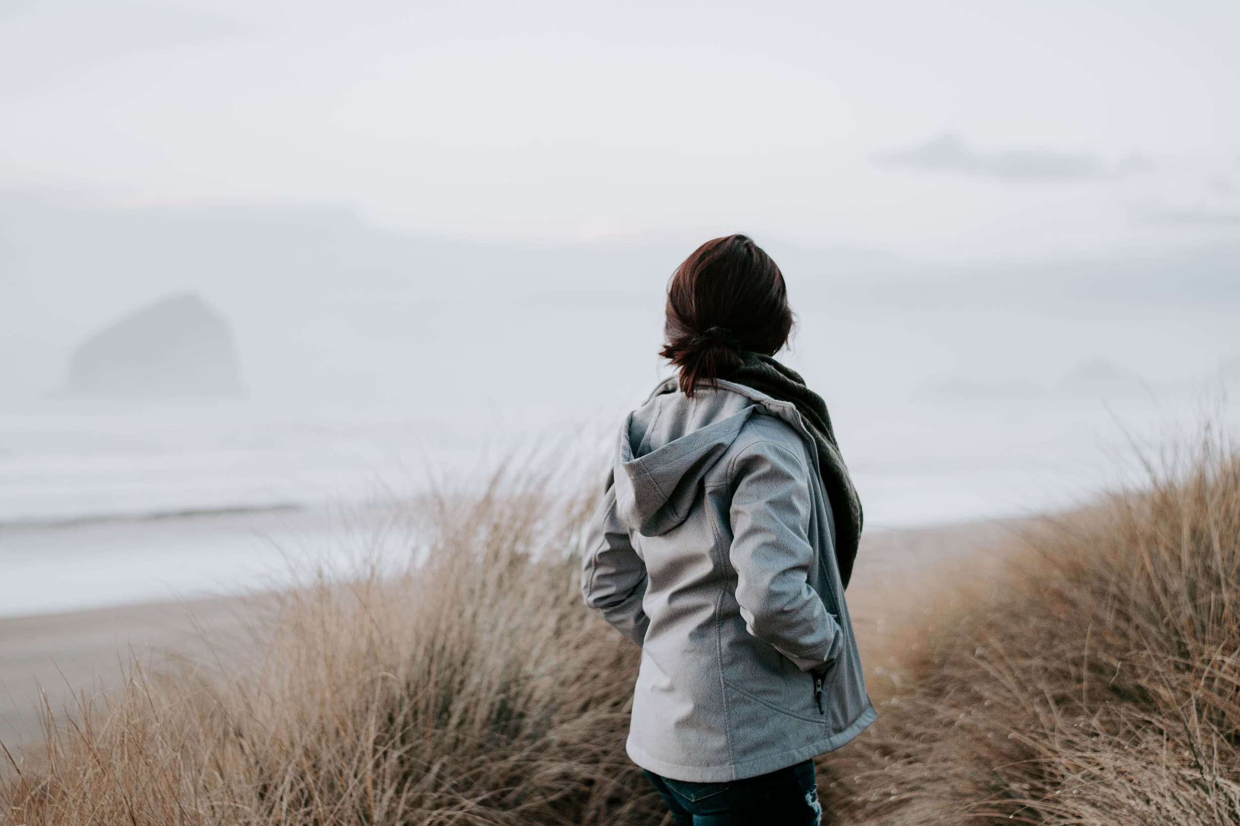 Lady Walking On The Beach